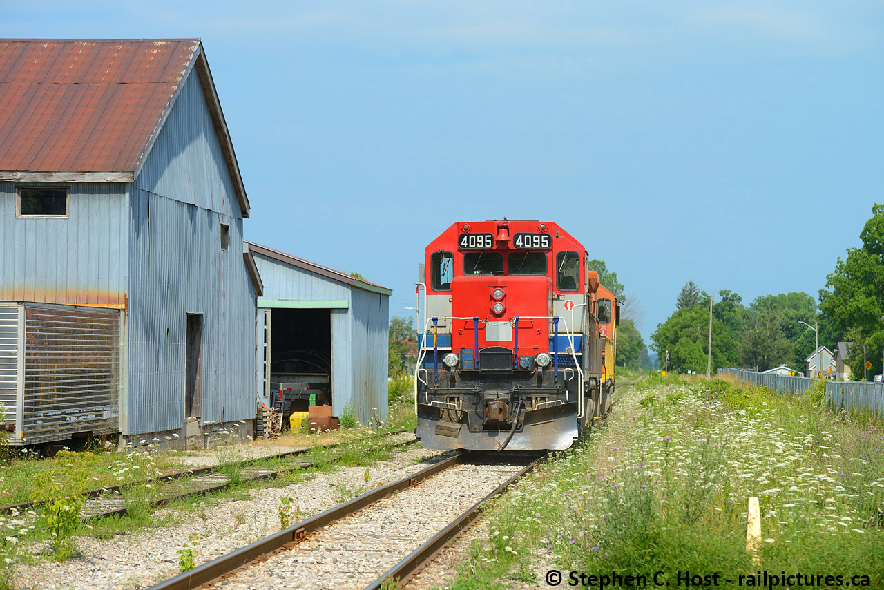 Built as CN 4004 in 1966 as a straight GP40, 4095 trails on GEXR 581 as they arrive in Clinton Ontario. Rarely can you get a train in perfect nose light on GEXR as they run west in the morning and east in the afternoon, but this light power move fit the bill. I was camping nearby in Auburn Ont with family and friends and timed a brief excursion to meet the train, perfectly as by the time I got trackside the train was in view. They ran light power Stratford to Hensall, grabbed 2 cars, and returned to Stratford, a 90 mile round trip. I repeated the same feat the next day in Goderich. Curious, how many straight 40's still exist and was this converted to a -2? I can't imagine there are many around. Also, P.S - I understand this area (exeter in particular) got hit hard with today's storm. Hope all is OK!