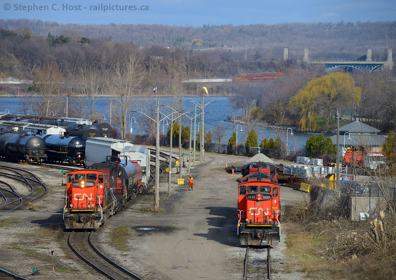 Seeing double, The 0700 yard job switches Hamilton Yard with GMD-1 1408 which had recently arrived from Winnipeg, and GMD-1 1439 waits for a crew to arrive to begin work. Notice how 1408 lacks a nose door and 1439 has one. Curious to why?