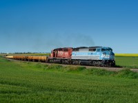 CMQ SD40-2F 9021 and CP SD40-2 5743 sound great, climbing towards Vulcan both in Notch 8 doing about 20mph with a heavy ballast train in tow.