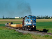 CMQ SD40-2F 9021 leads a loaded Swansea, BC - Calgary Alyth, AB ballast train north on the Aldersyde Sub approaching the town of Vulcan.