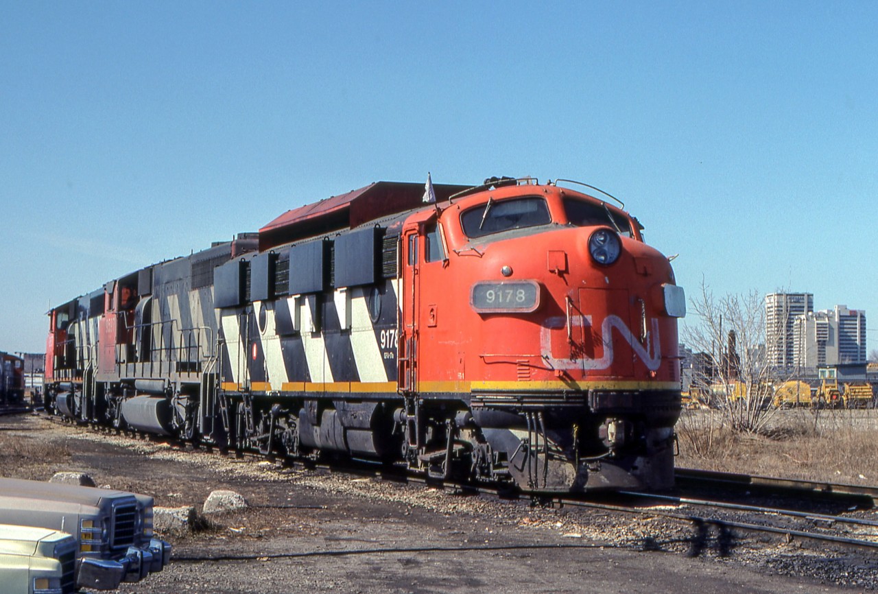 CN 9178, 9597, and 9657 are in London, Ontario on March 25, 1981.