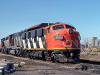 CN 9178, 9597, and 9657 are in London, Ontario on March 25, 1981.