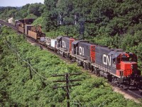 CN 5513, 5501, and 5520 are eastbound through Bayview Junction, Ontario on June 17, 1980.