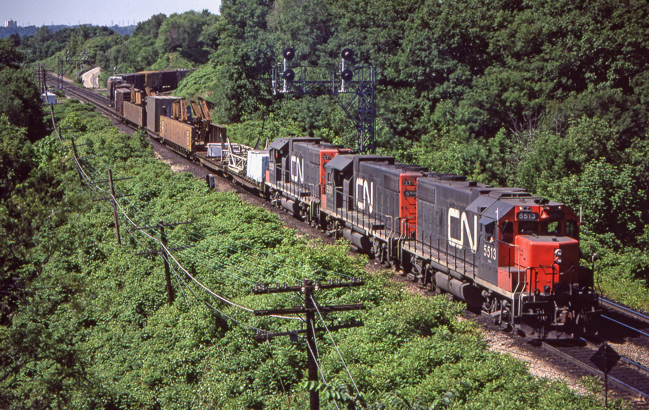 CN 5513, 5501, and 5520 are eastbound through Bayview Junction, Ontario on June 17, 1980.