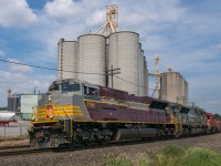 Of all the engines that could be around and bouncing back and forth day after day, CP 7016 and 6644 are a great pair. Seen here with a friendly wave from the conductor, the units are working hard to keep about 7000 feet of train moving through Streetsville.