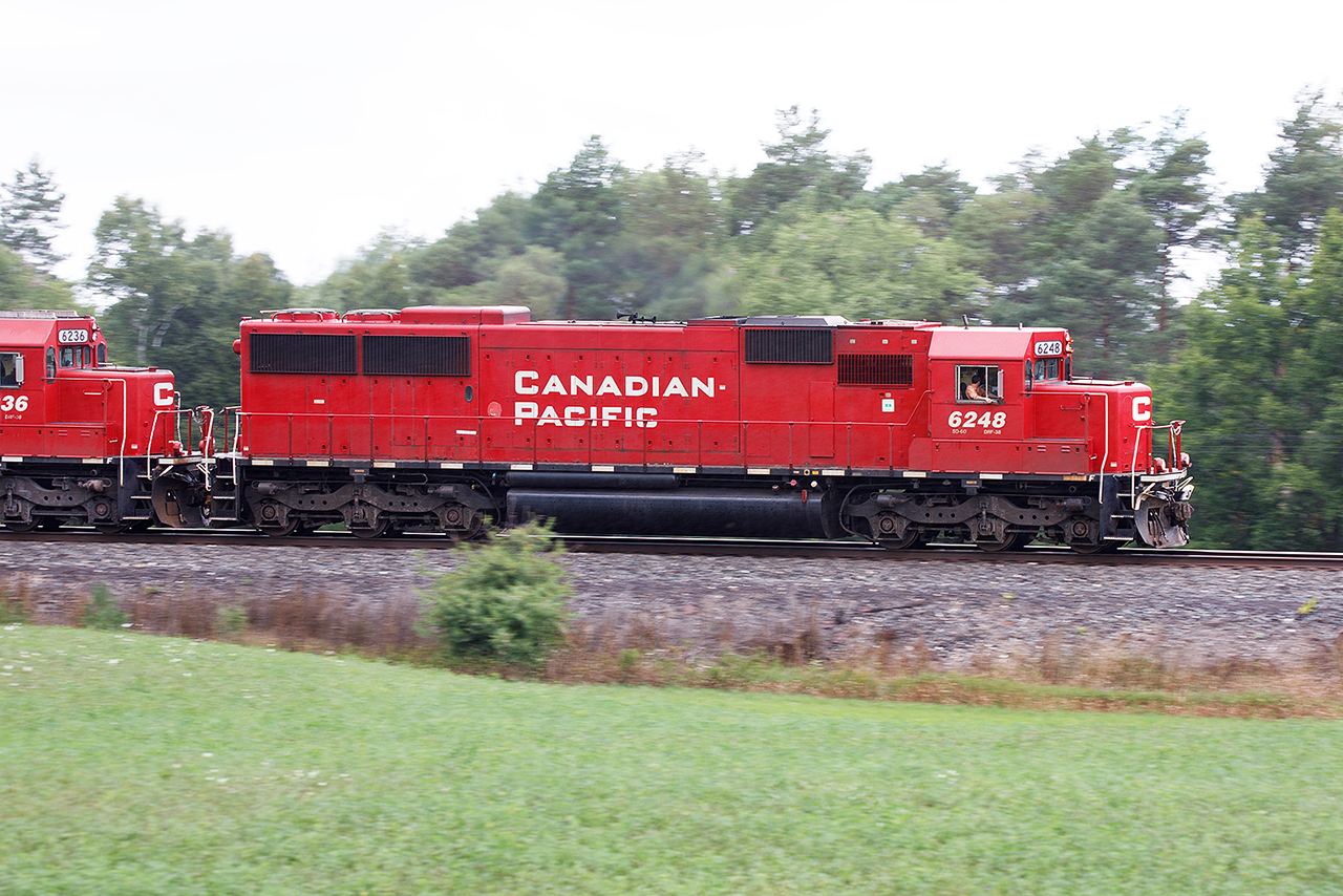 "Look at the frigging idiot standing on the van" might go the conversation from hogger to conductor as 254 rounds the curve at Galt Mile 53. He would be correct; it's windy with a light rain and I'm standing on the roof of my van trying for a semi-pan shot of one of the better non heritage consists I expect to see this year....6248, 6236, and 5012. They'll be back tomorrow afternoon, hopefully before sunset to try something else.....