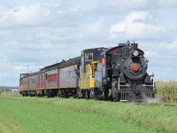 Surrounded by farms and cornfields between St. Jacobs and Elmira, the Labour Day Waterloo Central Railway (WCR) special with Engine No. 9 prepares for a photo run-by. A fun day out with family and friends! 