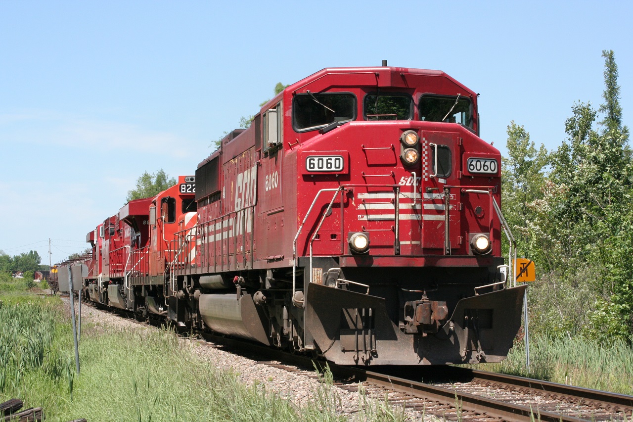 Wide-cab SD60M SOO 6060 leads a southbound freight, just entering the CP Hamilton Sub at Guelph Jct. Trailing units were a GP9 and two GEs. This may have been the only time I shot this type of SOO locomotive so this was hot. A chase down to Hamilton was in order so I managed to capture this run well. Funny though, I don't recall many other railfanners around! SOO locomotives were still circulating the CP system around this time so I guess it wasn't that difficult to catch one. Quite an interesting unit - it became CP 6260 if I recall correctly. If this unit did become 6260, then I shot it again recently trailing on 246 behind the CMQ unit on June 21!