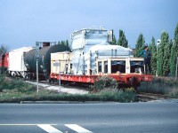 After lifting a flatcar with a freshly manufactured load from the ABB Company facility in Guelph, CP GP9u 1614 is viewed backing towards Woodlawn Road and eventually the nearby interchange with CN. Here, the CP local job will lift two boxcars left by CN that were either possibly for the W.C. Wood Company or for the lumber yards at Guelph Jct. in Campbellville.