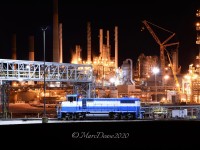 My mission on this hot summer night was to catch the 1943 built M/V MISSISSAGI discharging a load of stone in Sombra, ON. Upon arrival I grabbed my camera and stepped out of the car and was immediately swarmed by about 1000 blood thirsty mosquitoes. Mission aborted and I started heading home to Point Edward via HWY 40. As I crested the overpass by NOVA's Corunna Site there was switcher NCLX 2003 bathed in light and all done for the night. I couldn't pass up this opportunity so I pulled over and set up for a few shots and thankfully there no mosquitos.