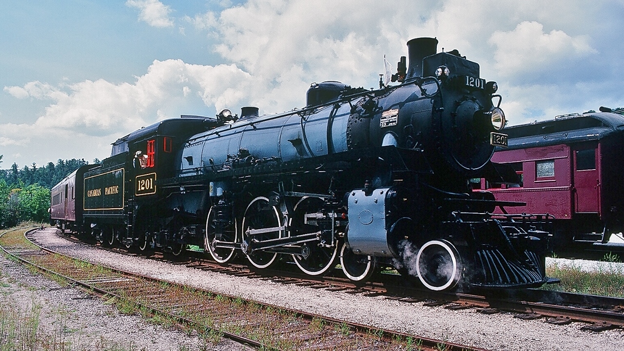 ...perfect poise...


...rods down...


  This youngster is a June 1944 build by the  CPR Angus Shops  class  G5a  #1201 


…successful steam ..( ...recently is a rare event...)...


… the 1970's / early 80's summer Wakefield steam trips – I believe a collaboration between the  Bytown rail group and the Museum of Technology -  very  well  done - 


…  why the regularly schedule summer excursions ceased? Perhaps a  combination of:  track/roadbed damage ( spring flooding) and or  federal  funding ending and or,  1201 boiler permit expiry, and  or ?  


 ...any way you view the present  situation: shame on YOUR Federal Government ( and those Senior Bureaucrats )  / Museum that 1201 languishes at the Museum's back shed: now infamously renamed the  ' conservation centre '   !!  This  is  bureaucratic language for     ' we can't be bothered with  a  live  operating STEAM museum ' ...shame shame … ( instead those bureacrats spend mega bucks (YOUR  $ ) on a VIRTUAL museum ! ) shame again !


  at Wakefield , August 1980  Kodak Kodachrome,  transported by a Nikkormat EL, by S.Danko


more summer steam 


 cruising   


 astounding performance   


 surprise location  


 high balling  


 road switcher  


 Great 1979 Escape  


 Sunnyside  


 sdfourty