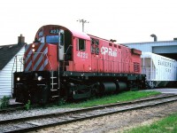 The W.C. Wood Company was a long standing Guelph appliance factory which was situated near the downtown core and along Arthur Street in Guelph. The Wood family, which began the business in Guelph during 1930, had sold the company to an American based equity firm in 2007. Not long after in November 2009, the company announced the plant's closure that included the elimination of 250 jobs. In later years the vacant building was demolished to make way for new upscale houses named the Metalworks. 
<br>
On a late June afternoon, CP 4222 is seen lifting a boxcar or two from the W.C. Wood Company plant at the Arthur Street crossing. The local had just previously switched the Owens Corning facility along York Road, which is where the Sandersville hopper was lifted from. While the lighting was not ideal at the time, 24 years later it does at least give a perspective of what the area looked like in 1996.

