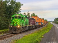 For the first time in over 25 years, a Canadian Pacific intermodal train has landed in Southern New Brunswick. A pair of NBSR SD40's power a 10,000 foot empty stack train through the community of Tracy, destined for the port at Saint John, New Brunswick, where a Hapag Lloyd ship is currently docked and waiting. This train had a pair of CP toasters up until Brownville Jct, Maine, where the power was swapped for NBSR power. 