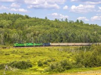 MNR 6340, former Southern Pacific, leads New Brunswick Southern Railway train 907 through the fields of Southern New Brunswick, at Clarendon. 