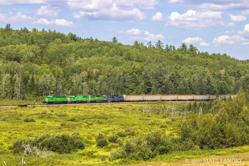 MNR 6340, former Southern Pacific, leads New Brunswick Southern Railway train 907 through the fields of Southern New Brunswick, at Clarendon.