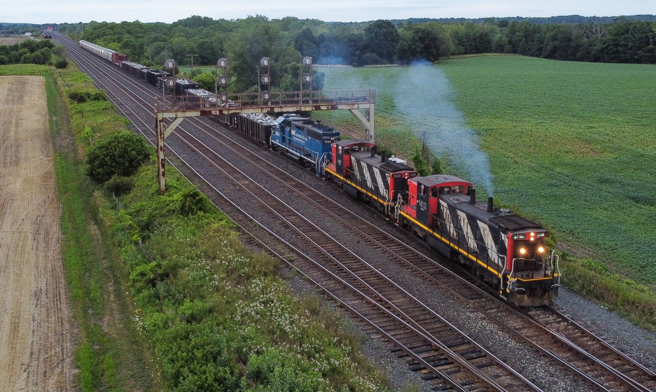 CN L583 departs Paris on a stormy evening with CN 1412, CN 1439 and GMTX 2695.