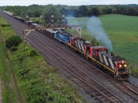 CN L583 departs Paris on a stormy evening with CN 1412, CN 1439 and GMTX 2695.  