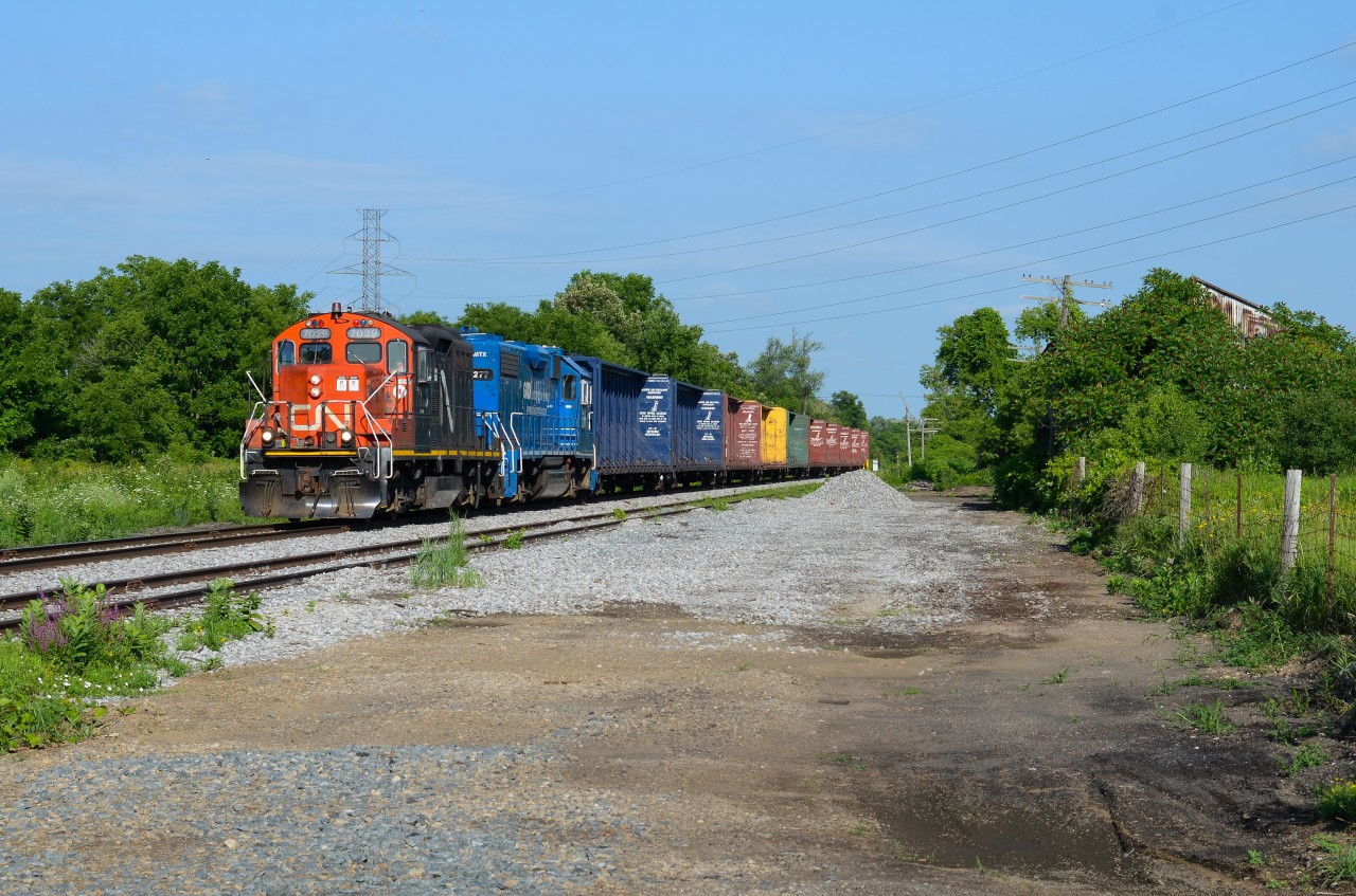 L580 cruises by the siding at Onondaga at 25mph with 10 empty centrebeams for CGC in Hagersville in the early hours of the day with full sunshine. Near the head end of the train stood the Onondaga mile board which I believe was taken out shortly after CN took over operations, would’ve been great framing if it still stood with the old shack on the right but then again I don’t think this spot was as open as now. It’s very trimmed/flattened out now providing an open angle with the code line very visible.