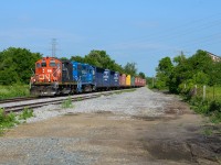 L580 cruises by the siding at Onondaga at 25mph with 10 empty centrebeams for CGC in Hagersville in the early hours of the day with full sunshine. Near the head end of the train stood the Onondaga mile board which I believe was taken out shortly after CN took over operations, would’ve been great framing if it still stood with the old shack on the right but then again I don’t think this spot was as open as now. It’s very trimmed/flattened out now providing an open angle with the code line very visible. 