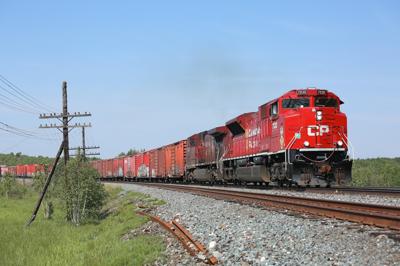 With a healthy cut of boxcars on the head end, train 420 is approaching the junction at Romford. There the train will pass from the Cartier Sub to the Parry Sound Sub and continue on its journey to Toronto. 7030 wears the shield of Lord Strathcona's Horse on its nose - the second CP locomotive to do so following in the footsteps of ES44AC 8939.
