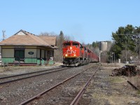 A late morning departure from North Bay allowed for some decent light on train 450 as it passed through South River.  The old station, built in 1884 by the Northern and Pacific Junction Railway, and derelict coaling tower stand guard as a testament to the town's railway history.