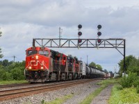 CN 369 ducking underneath an old signal tower by station sign Coteau. The last 3 units likely came out of storage at CN’s Taschereau yard in St Lambert QC, as they were offline and cause those units haven’t been out for some time. 