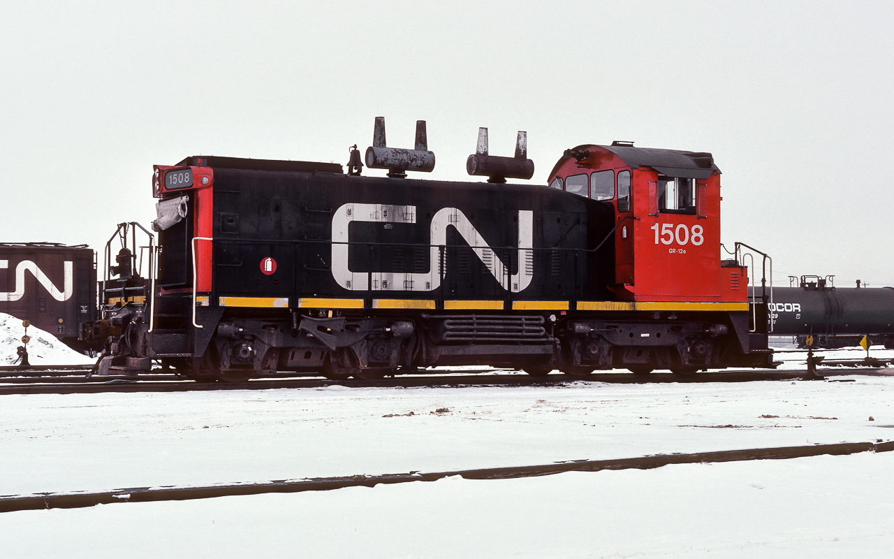I stopped in at the downtown city yard on a Saturday morning knowing that the majority of crews here have the weekend off. I surely expected to find several switch engines and that was certainly the case. This is the west leads goat parked in its usual spot by the yard office which is just out of the picture to the right. They will be one of the few jobs working today. The usual routine for them will be switching the yard until around lunch and then after lunch take a transfer to the NAR and bring one back for interchange with the CPR. The CP yard at that time is behind me in this picture (south side 104th ave.). The only thing today remaining of both railroads in downtown is the CN tower, which even that is no longer owned by CN. Behind the black Procor tank, parked on the shop track, the 1263, 1264, 1291 and 1507 are idling and waiting for their next call to duty. During my time at CN, the typical goats at the city yard will have been a thirteen hundred for the west lead and on the shop track there will have been the 7100 number series SW8's with the occasional SW900 in the 7200 series. Checking the CNRHA, the 1508 only has 5 years to go from this date before retirement and it seems there was no second life for this unit.