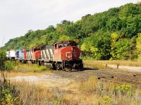 CN "Laser Train" 238 descends the Niagara Escarpment grade with 9650, 9631 and GT 5929 during an early fall morning as it passes the location of the former Dundas station. While probably a few feet away from an exact "Time Machine" comparison it still shows the differences over 34 years later compared with Doug Page's great image at the same location. 
<br>
http://www.railpictures.ca/?attachment_id=42433

