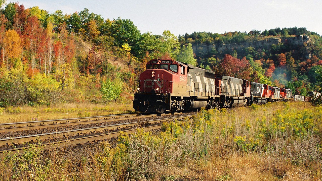 CN 433 climbs up the grade through Dundas during an early fall morning with a solid four-axle consist that included; 9525, 3518, 3502, 4136 and 7034.