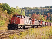 The fall colours were beginning to emerge as a mid-morning CN westbound powered by 5361, 5049 and 5356 dragged 93 cars up the Niagara Escarpment through Dundas on the appropriately named Dundas Subdivision. This photo was taken across from where the small station once stood under famed Dundas Peak. 
