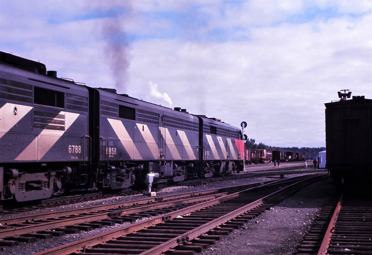 An all MLW consist leads CN's Super Continental, train 2, east out of Capreol, Ontario in September 1967. Power is an interesting mix including FPA-2 6752, FPB-2U 6858, and FPA-4 6788. Oh how I now wish I had taken the time to capture all that interesting work equipment visible ahead of the train. And yes, those people did cross in front of the train!!