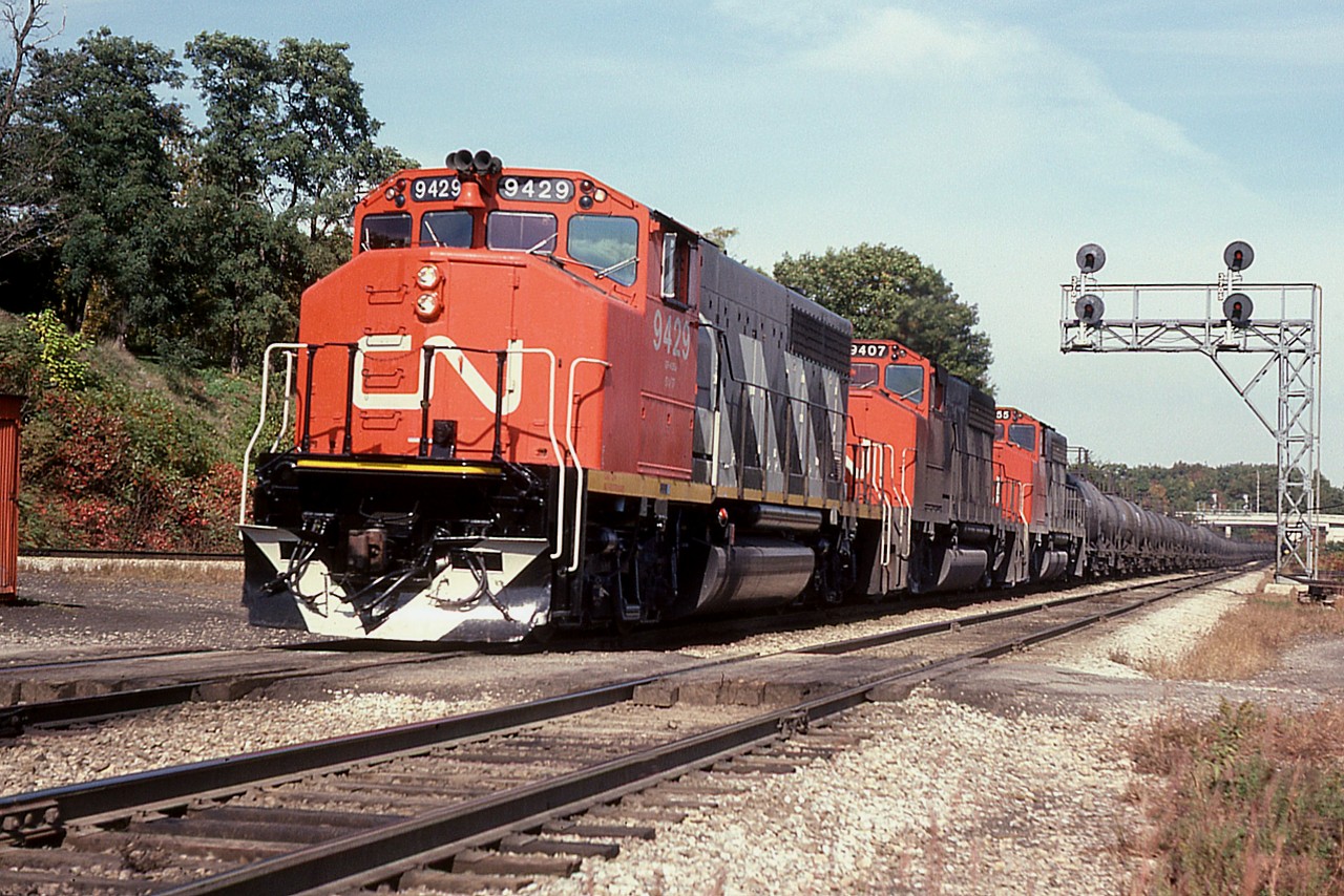 Nice trio of GP40-2L (W) locos, CN 9429, 9407 and 9455 roll Niagara-bound with what I had marked on the slide as an 'oil train', although I cannot recall where this would have come from or what it's destination was. I am sure someone viewing this can fill me in.  Thanks!!