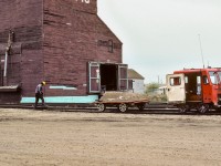 This is a scene that I have not seen trackside in several years. One fellow pounding in spikes that have lifted, the other tightening the bolts on rail joints. Plus a little flat car in tow with a rail jack as a load. Same speeder as the one that I just posted a while back and I still cannot make out the number (for those who may inquire).