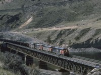 Eastbound CN 2430 with the 2411, 2440 and 2416 trailing, are pulling an empty coal train across the Thompson River on CNs Ashcroft Sub.  