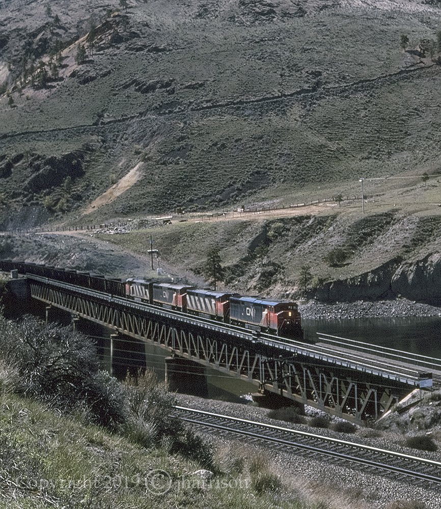 Eastbound CN 2430 with the 2411, 2440 and 2416 trailing, are pulling an empty coal train across the Thompson River on CNs Ashcroft Sub.