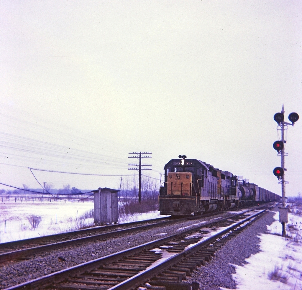 A dreary winter afternoon, Bruce and I went on a jaunt to Canfield Junction and then to E&O Tower on the NYC / PC CASO sub. A Kodak Instamatic Moment captured the westbound C&O train not long after it clattered over the diamond of the TH&B at E&O.We spent about 2 hours at E&O and saw 4 trains, C&O, PC(2) as well as the TH&B Port Maitland job. Previously we spent couple of hours at Canfield Junction and saw five trains, C&O, CN and PC. Oh for the want of a better camera those days.