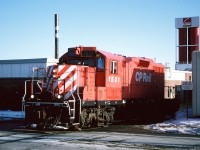 CP GP7u 1501 is viewed switching the Owens Corning facility located along York Road in Guelph. This was a regular switch for the CP Guelph local job during the mid-1990s. In the winter months when the sun was lower the shadows here could make it tough to photograph depending on when the local arrived at the plant. The crew could sometimes spend quite a bit of time here lifting and setting-off hoppers that had clay in them for the manufacturing of fiberglass composites. This day, 1501 set-off and lifted one car before proceeding to switch the Huntsman Chemical Corporation plant on its way back to Guelph Jct. 