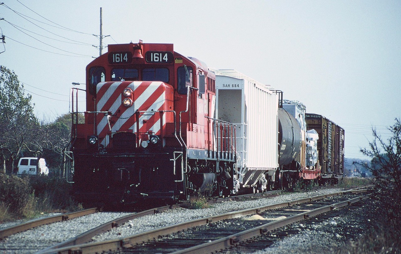 Following its lifting of two boxcars, CP GP9u 1614 is seen ready to depart the interchange with CN in Guelph along parallel Edinburgh Road. Two months later to the day, 1614 would be assigned to the last CP train to operate over the Guelph Junction Railway.