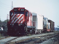 Following its lifting of two boxcars, CP GP9u 1614 is seen ready to depart the interchange with CN in Guelph along parallel Edinburgh Road. Two months later to the day, 1614 would be assigned to the last CP train to operate over the Guelph Junction Railway.