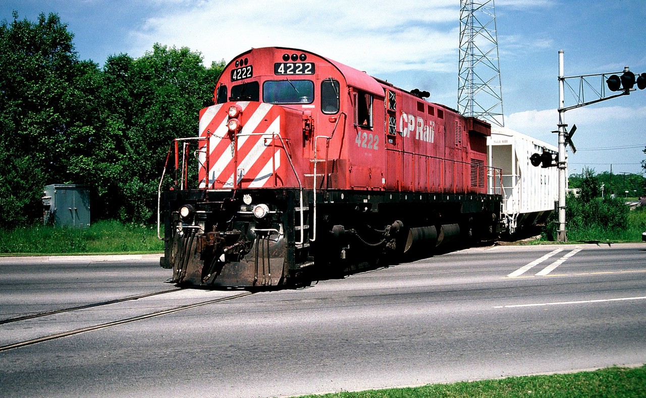 C424 4222 leads the CP Guelph local across Victoria Road in Guelph with one hopper for Owens Corning after arriving from Guelph Jct. At the time seeing this unit on the local was a real surprise as it was normally not assigned C424's and usually operated with single GP7u/GP9u's and the occasional RS18u.