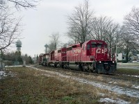 Seen in this image, CP's #558 heading toward the states; a mile to do as it passes over Eastwood Cres along the line that parallels Palmer Av for a stretch. Line is gone now, and is a walking/biking trail for some of its' length. Power is CP 5994, 749, HLCX 6206, CP 5674. The HLCX is former B.C. Rail. The towers of Clifton Hill tourist mecca can be seen in the background.