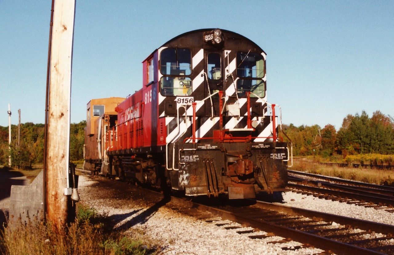 On a quiet Sunday morning in September 1994, CP SW1200RS 8156 is seen with a caboose at Guelph Jct. in Campbellville. This would likely be the power for the local that operated to Guelph to service industries on the Guelph Junction Railway during the week.
