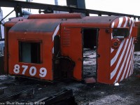 A traffic downturn in the mid-1970's caused CP to return a lot of its leased power, and park or retire some of its own older units. This ultimately spelled the end of CP's Alco/MLW FA/FB units, and the entire Fairbanks-Morse/Canadian Locomotive Company fleet. In March 1975, the remaining active C-liners and H16-44's were all rounded up en masse from their outposts in Nelson, Cranbrook and Lethbridge, and sent to Ogden Shops in Calgary for storage and to meet an uncertain fate. Most ended up like 8709 here - cut up for scrap. The FM opposed-piston engines out of many were resold to a marine equipment company in Houston TX for marine use, and CP salvaged various common components as spares to use in their MLW fleet, including the GE 752 traction motors, wheels, bearings, axle sets and air compressors.
<br><br>
By that time, the <a href=http://www.railpictures.ca/?attachment_id=40661><b>final three "Train Master" H24-66 units</b></a> had been assigned to the Alyth hump, and lasted a few months longer before they too were parked.
<br><br>
<i>Original photographer unknown, Dan Dell'Unto collection slide.</i>
