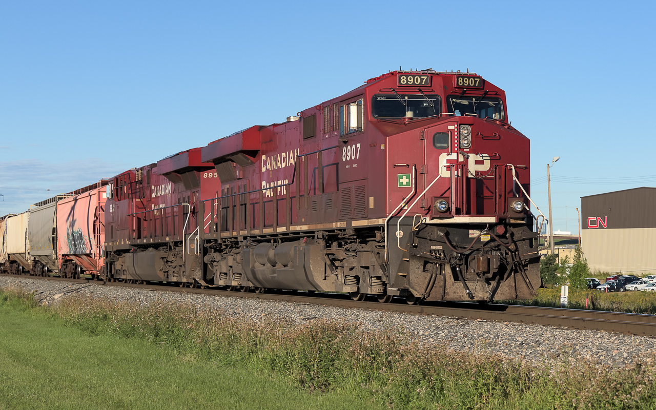I had a little fun with CN - CP in the same photo this morning. This is the Fort Sask. switcher finally on the move after waiting for a couple of CN trains to clear the diamond at Clover Bar. I have not been at the tracks for a few weeks and what a difference today. 6 trains, all in good morning light, in an hour and half. I have not seen this much action in awhile. I must thank M. Berry for his recent comment that they are bringing CN GE barns back into service. It got me thinking, if it is busy there (Quebec) it could be busy again here, it is.  :-)