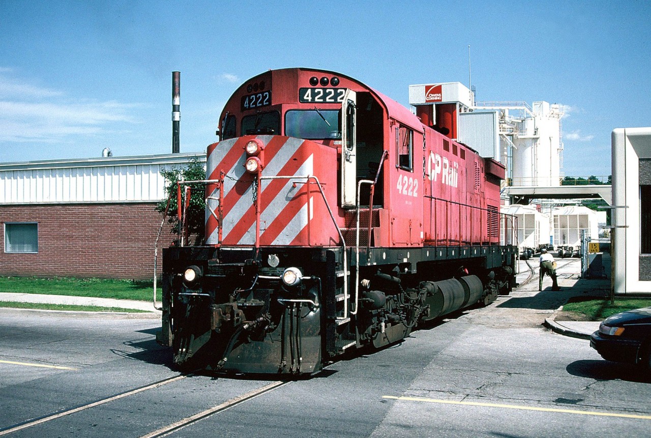 CP C424 4222 blocks traffic as it switches the Owens Corning plant across York Road in Guelph. The afternoon lighting here was always the best during the summer months and the timing would work out well as the CP Guelph local usually departed Guelph Jct. sometime after lunch for Guelph. During the mid-1990's Owens Corning was one of the biggest users of rail as they received hoppers of materials for the manufacturing of fiberglass composites.