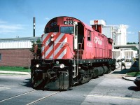 CP C424 4222 blocks traffic as it switches the Owens Corning plant across York Road in Guelph. The afternoon lighting here was always the best during the summer months and the timing would work out well as the CP Guelph local usually departed Guelph Jct. sometime after lunch for Guelph. During the mid-1990's Owens Corning was one of the biggest users of rail as they received hoppers of materials for the manufacturing of fiberglass composites. 
