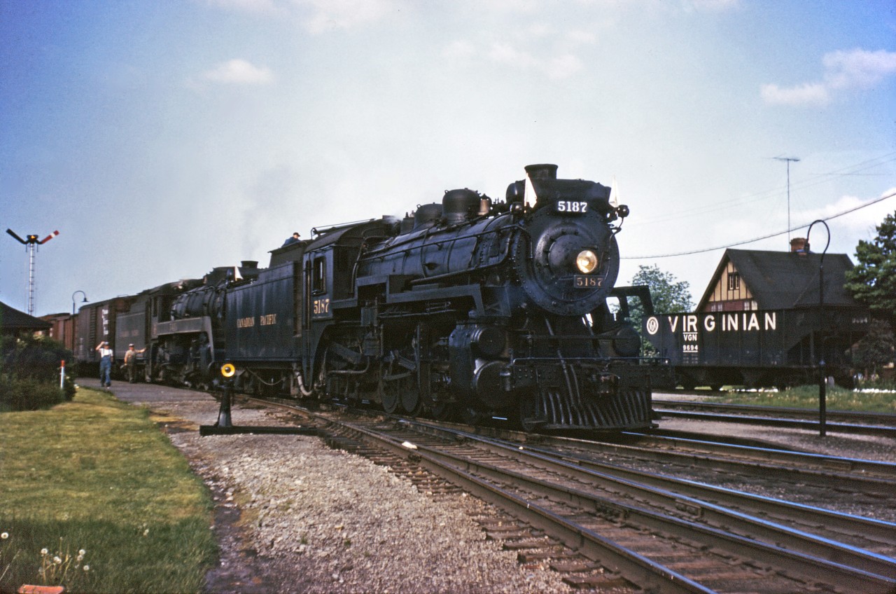 CP 2-8-2 5187 and a 5400 series Mikado pause at Guelph Junction with an Extra West in the fall of 1959 (unfortunately, I only have the slide processing date, not the exact date of the photo). Normal practice was for helper engines to continue as far as Orr's Lake...Diesel railroading just isn't the same!

(Special thanks once again to Dan Dell'Unto for his assistance in editing this shot.)