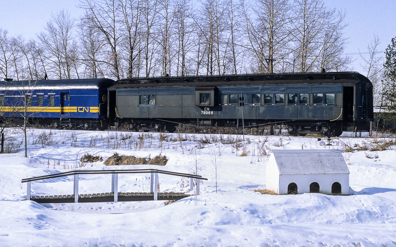 A late return home for the Muskeg Mixed finds it passing through the hamlet of Coronado at 13:30 rather than the dark hours in the middle of the night. The comboose is ex-NAR and has a history that goes back to the turn of the previous century (18 to 1900's). Up front the consist was made up of the 4319, 9172 and 4285.