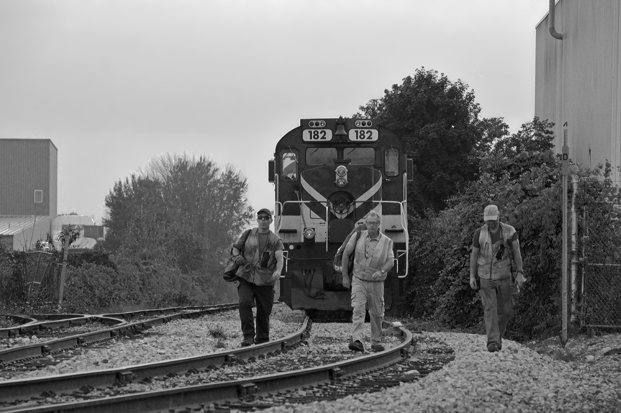 Final Frame.  Conductor Paul Jarvis, Engineer Andrew Nichol, and Conductor Karol Belawski (left to right) have tied down the final OSR movement over the Guelph Junction Railway, closing out 22 years of operations.  All the best to the boys of the OSR.