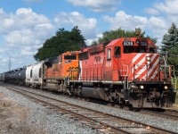 CP 6018 and BNSF 8465 blast through Orrs Lake on a sunny August day.  After finishing work for the morning I headed for Orrs Lake, only beating the train here by about 20 seconds.